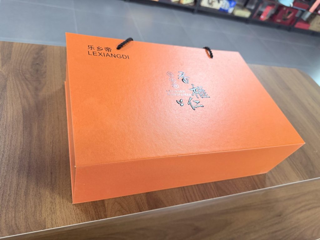 Bright Orange Rigid Gift Box With Black Rope Handles Premium Packaging - view