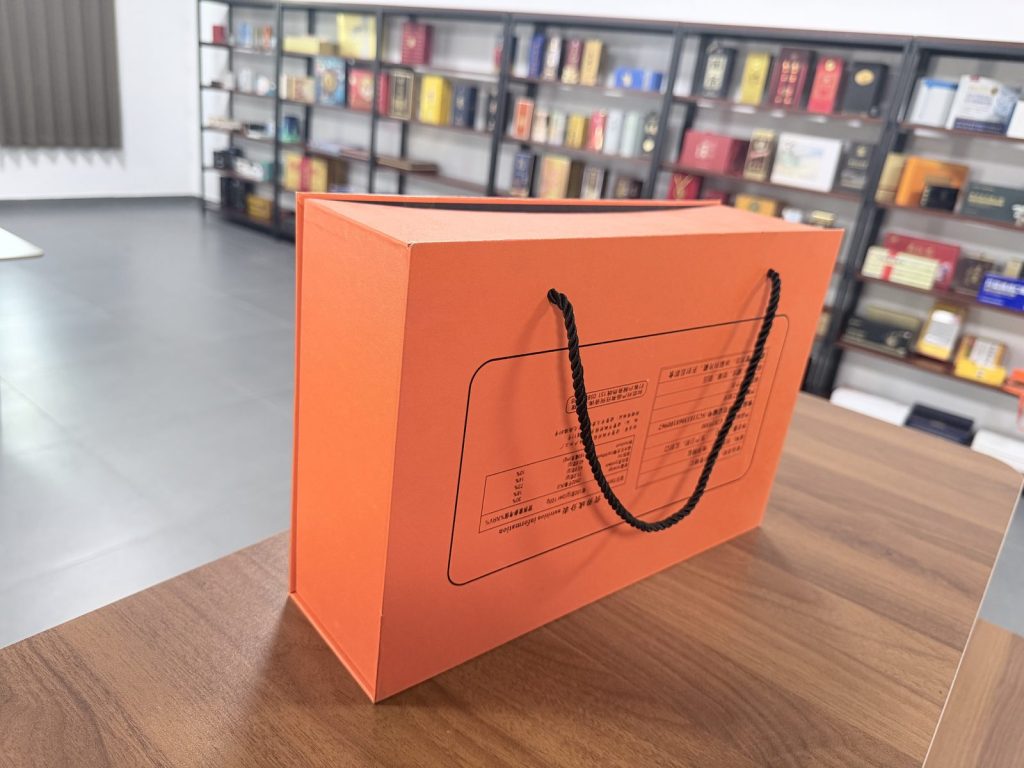 Bright Orange Rigid Gift Box With Black Rope Handles Premium Packaging - view