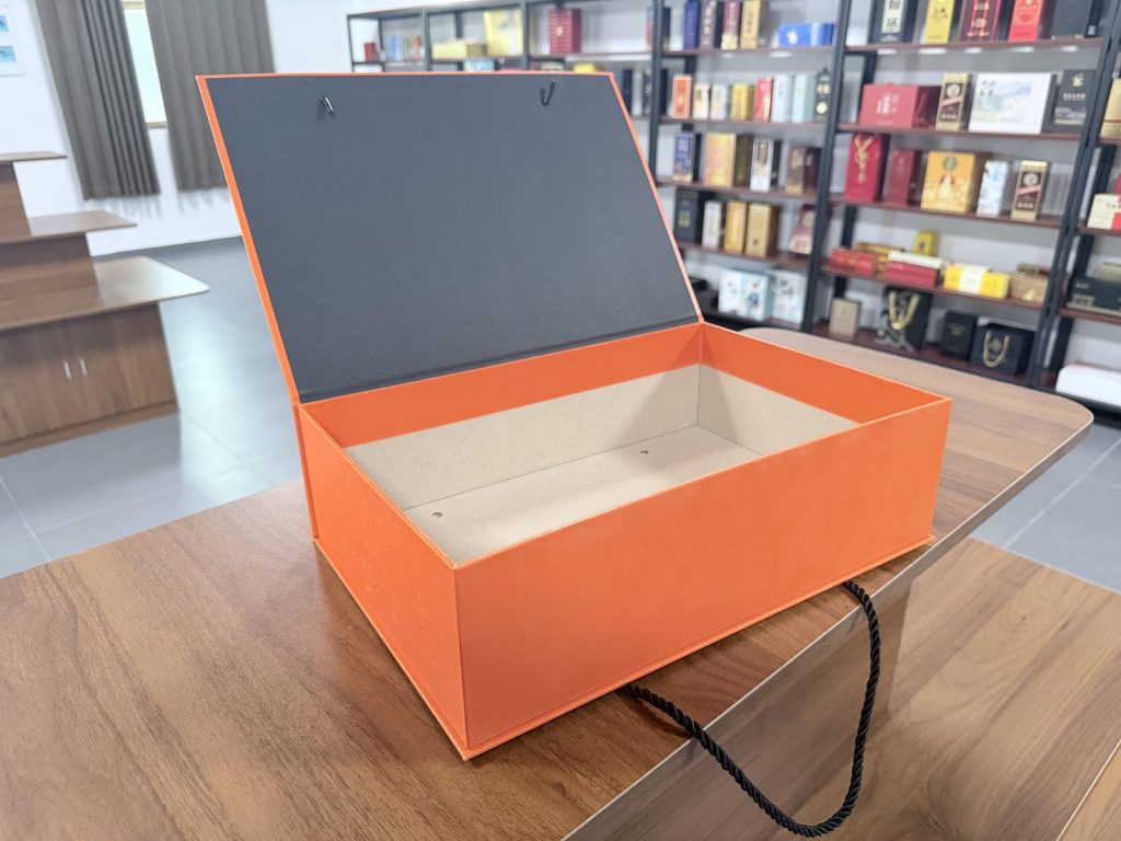 Bright Orange Rigid Gift Box With Black Rope Handles Premium Packaging - view