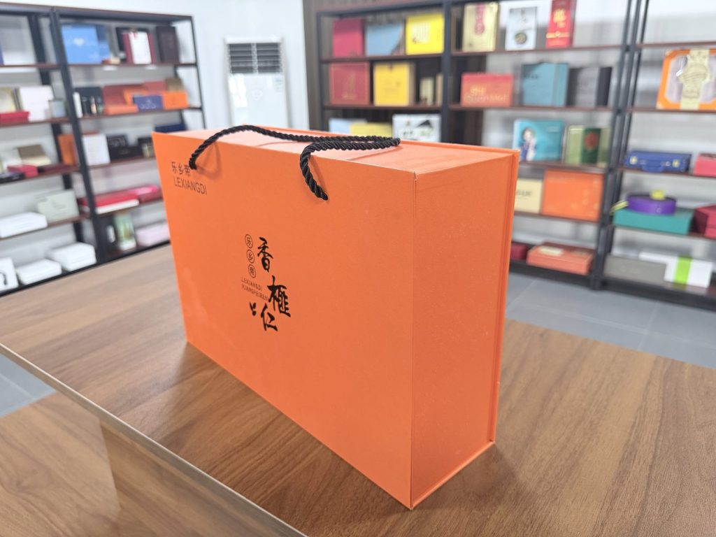 Bright Orange Rigid Gift Box With Black Rope Handles Premium Packaging - view