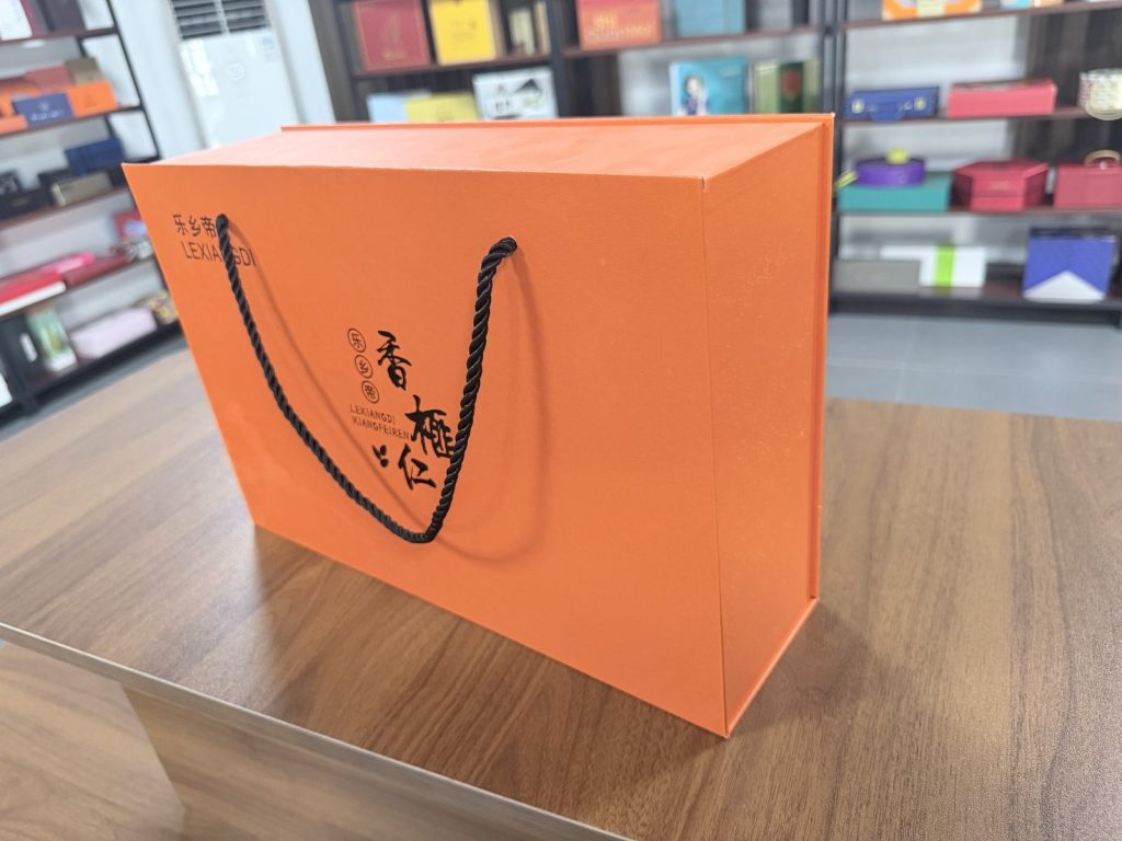 Bright Orange Rigid Gift Box With Black Rope Handles Premium Packaging - view